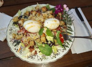 A Caesar style summer salad served on a decorative plate